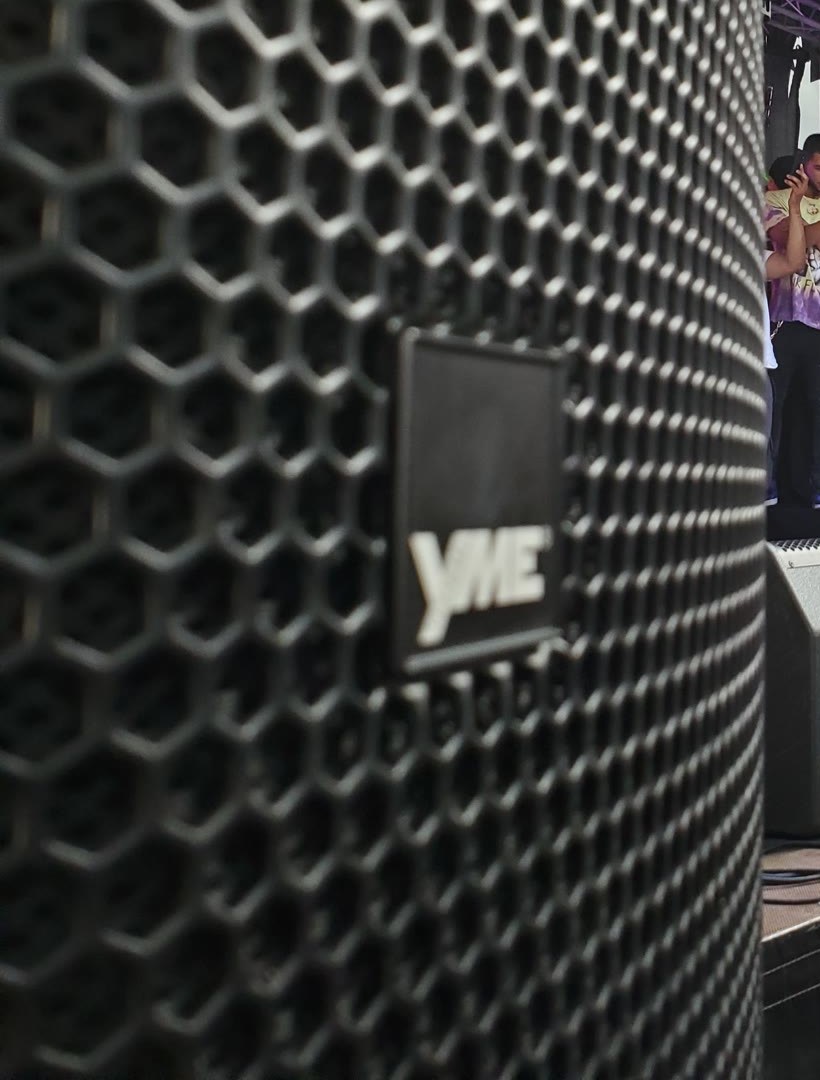 Close-up of an authentic YME loudspeaker grille and cabinet with the YME badge